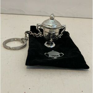 Preowned US Open miniature trophy keychain.